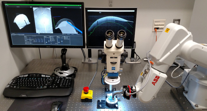 Image of a robot and microscope